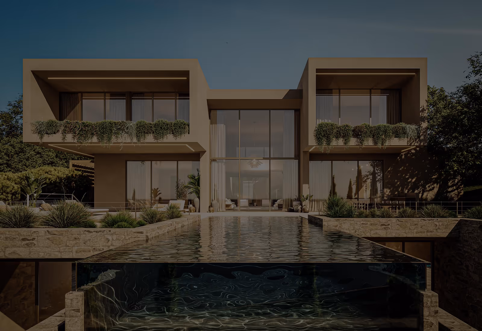 Ao anoitecer, casa de dois pisos em dois volumes emoldurados, com varandas plantadas, grandes envidraçados e uma piscina de borda infinita com a frente em vidro.