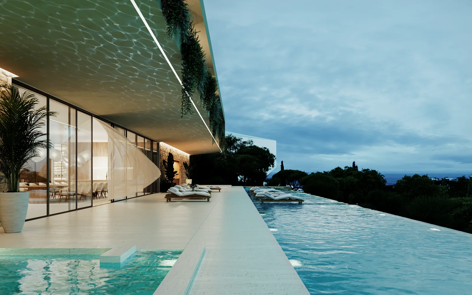A mesma piscina ao anoitecer, iluminada por baixo, uma linha contínua de luz sob o bordo da cobertura e o mar já escuro ao fundo.